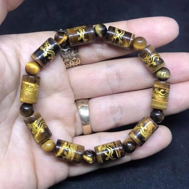 Vòng tay đá mắt hổ chạm rồng 8ly