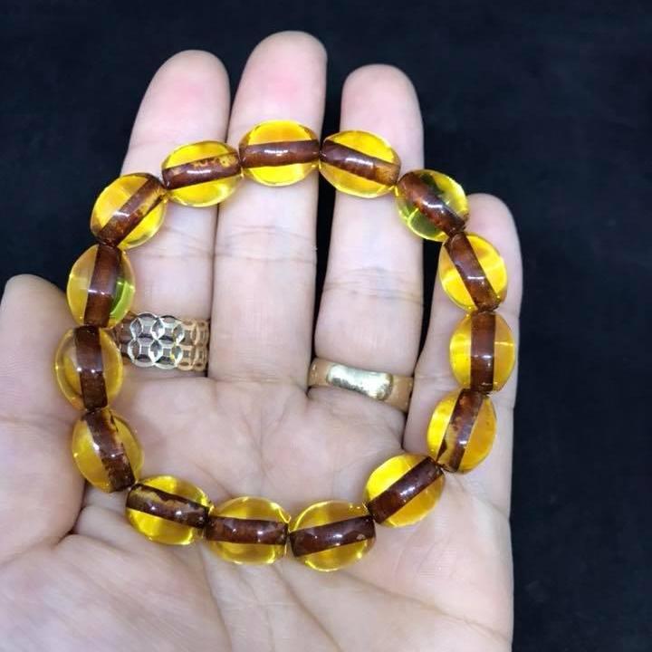 Vòng tay hổ phách vàng hạt bầu dục 10ly